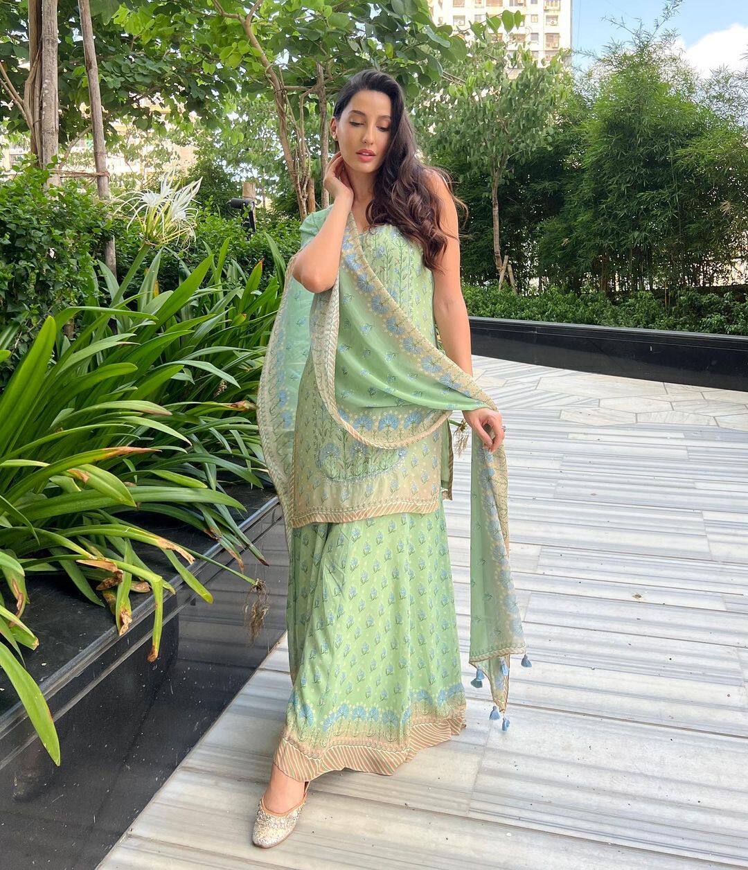 Nora Fatehi charms in green