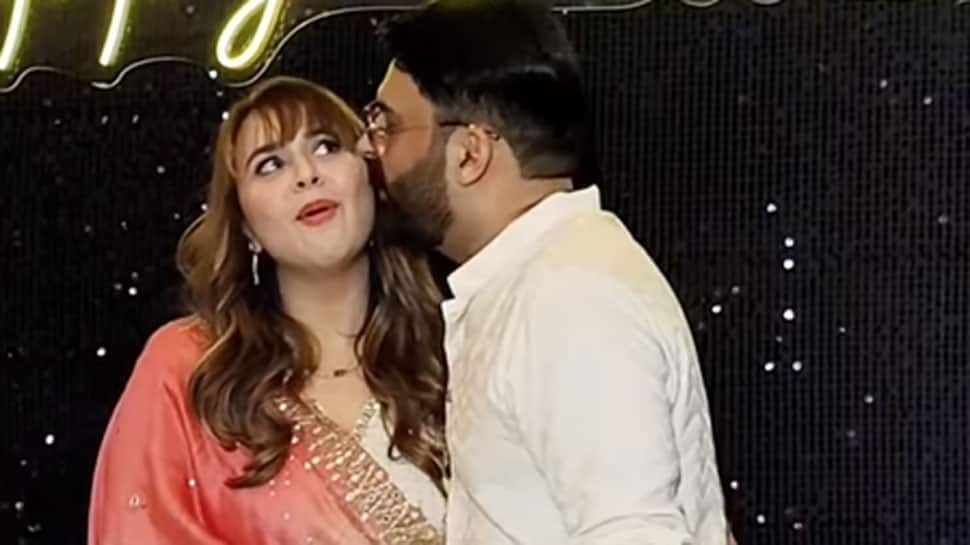 Kapil Sharma kisses wife Ginni Chatrath while posing for paps, her reaction is PRICELESS! Watch