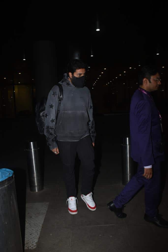Abhishek Bachchan donned black outfit with white sneakers