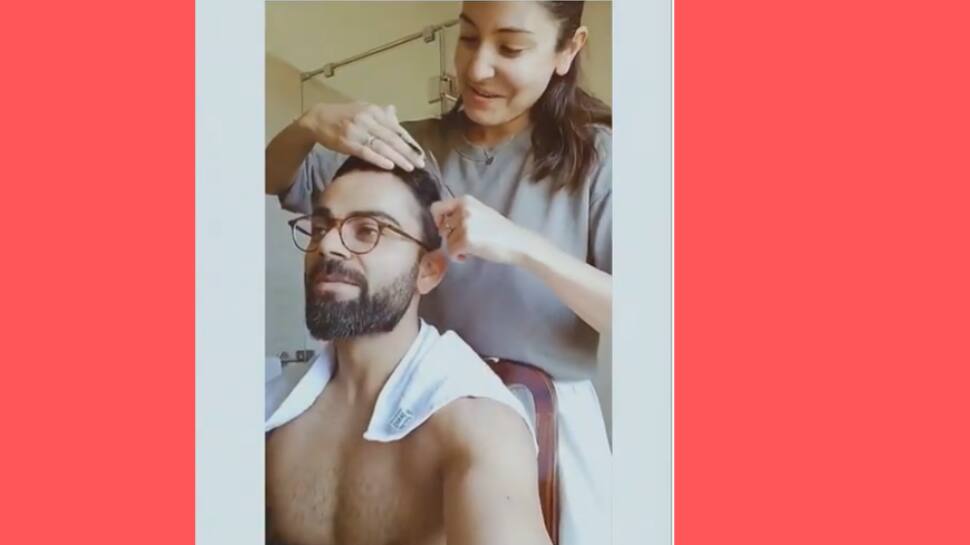 Anushka Sharma cutting Virat Kohli's hair