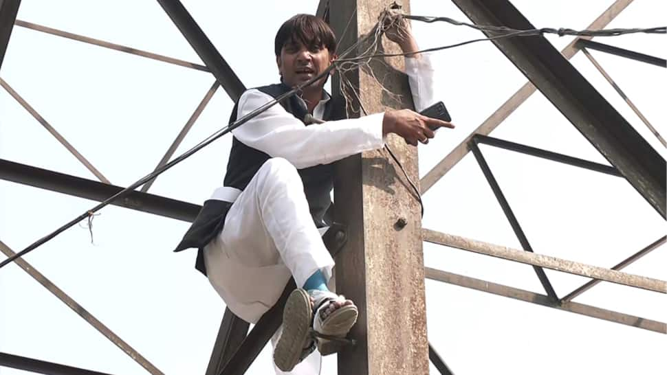 Former AAP councillor denied MCD poll ticket, climbs electricity tower in protest; claims it&#039;s being &#039;sold for Rs 2-3 cr&#039;