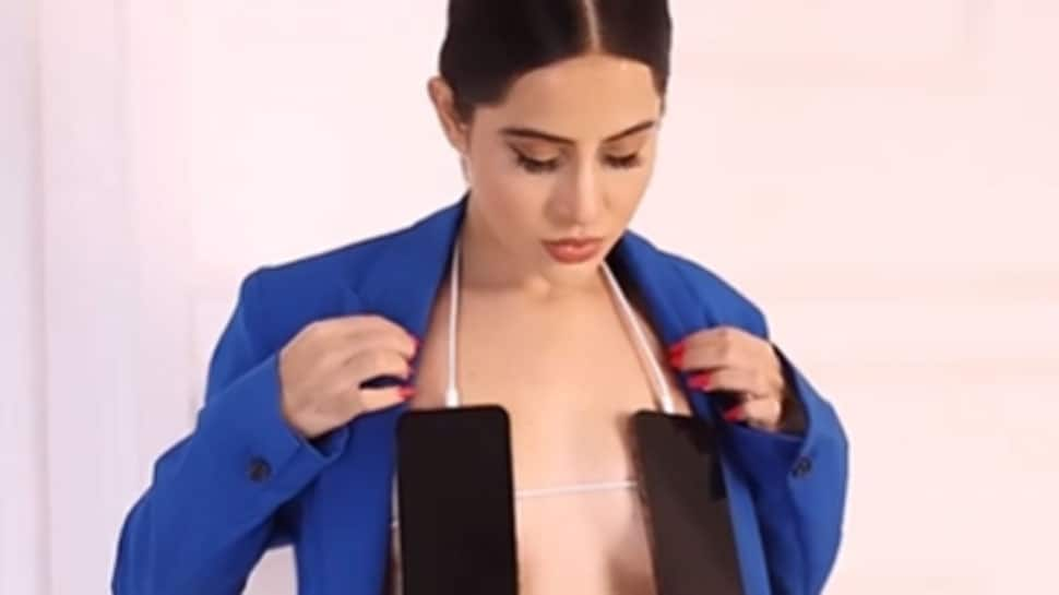 Urfi Javed is all CHARGED UP, wears mobile phones as bralette in new bizarre video - Watch