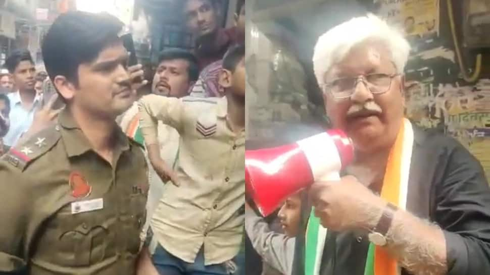 WATCH: Congress MCD candidate&#039;s father MANHANDLES cop in Shaheen Bagh; FIR registered