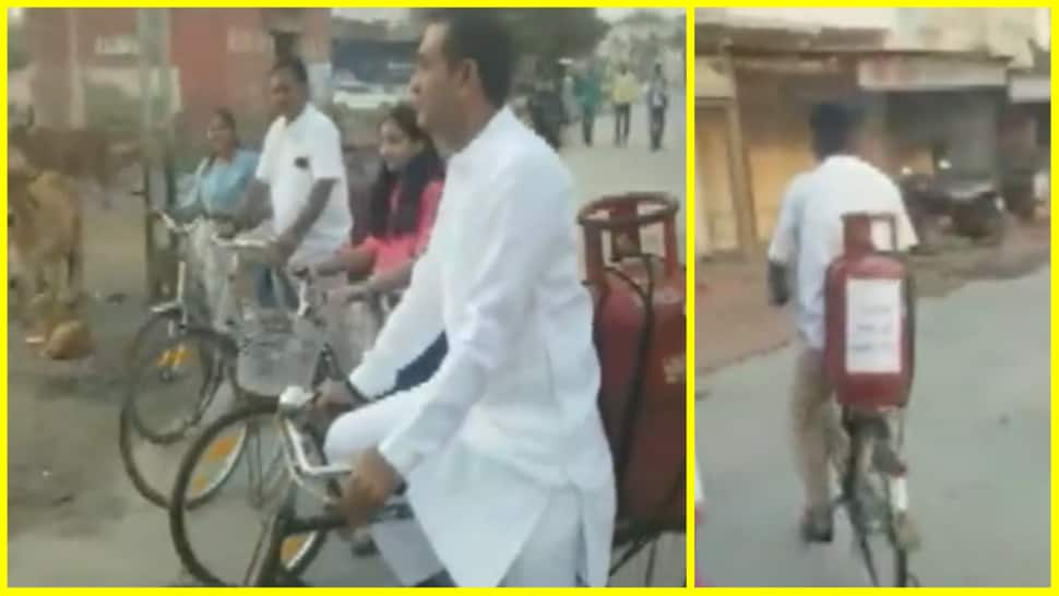 Gujarat Assembly Elections 2022: Congress MLA Paresh Dhanani rides bicycle with gas cylinder to polling booth - WATCH