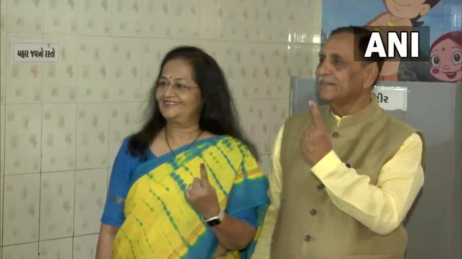 Ex - Gujarat CM Vijay Rupani and his wife cast votes