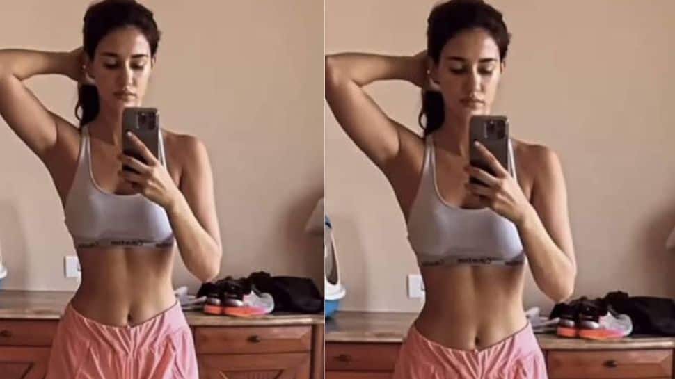 Flaunts toned abs