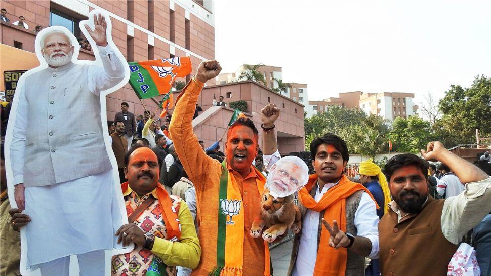 BJP workers smear in color celebrating victory in Gujarat Assembly Elections