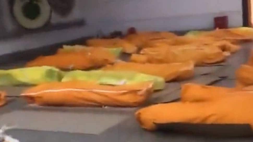 MASSIVE Covid outbreak in China: Videos show PILES of DEAD BODIES, people sharing hospital beds - Watch