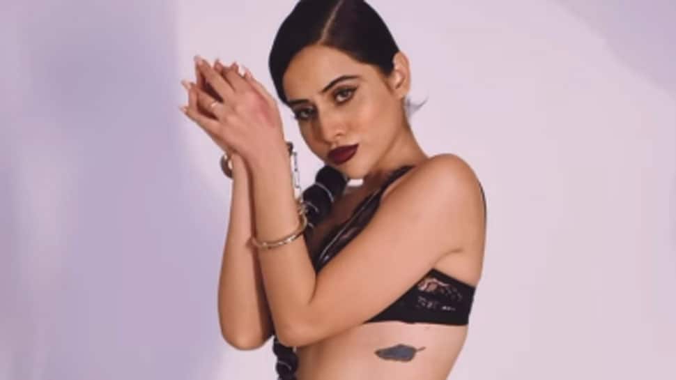 &#039;Handcuffed&#039; Urfi Javed shows off her sultry dance moves in a black monokini, hits back at haters - Watch