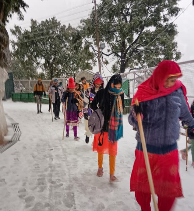 Vaishno Devi pilgrims walk through snow