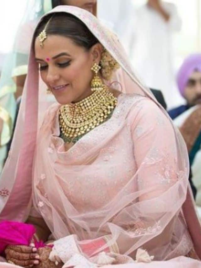 Photo of A bride in a pink lehenga with contrasting green jewellery |  Indian bridal outfits, Indian wedding guest dress, Pink lehenga