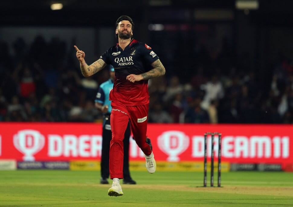 RCB pacer Reece Topley celebrates after picking up the wicket of MI all-rounder Cameron Green, their most expensive player at IPL 2023 auction, for 5. Topley had too leave the field early after injuring his shoulder and only managed to bowl 2 overs. (Photo: ANI)