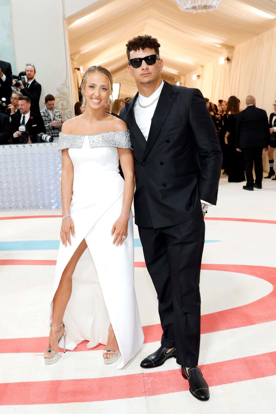 Super Bowl-winning quarterback Patrick Mahomes turned up in a black suit from Hugo Boss. His wife, Brittany, wore an off-the-shoulder white gown that was bedazzled at the top. (Source: Twitter)