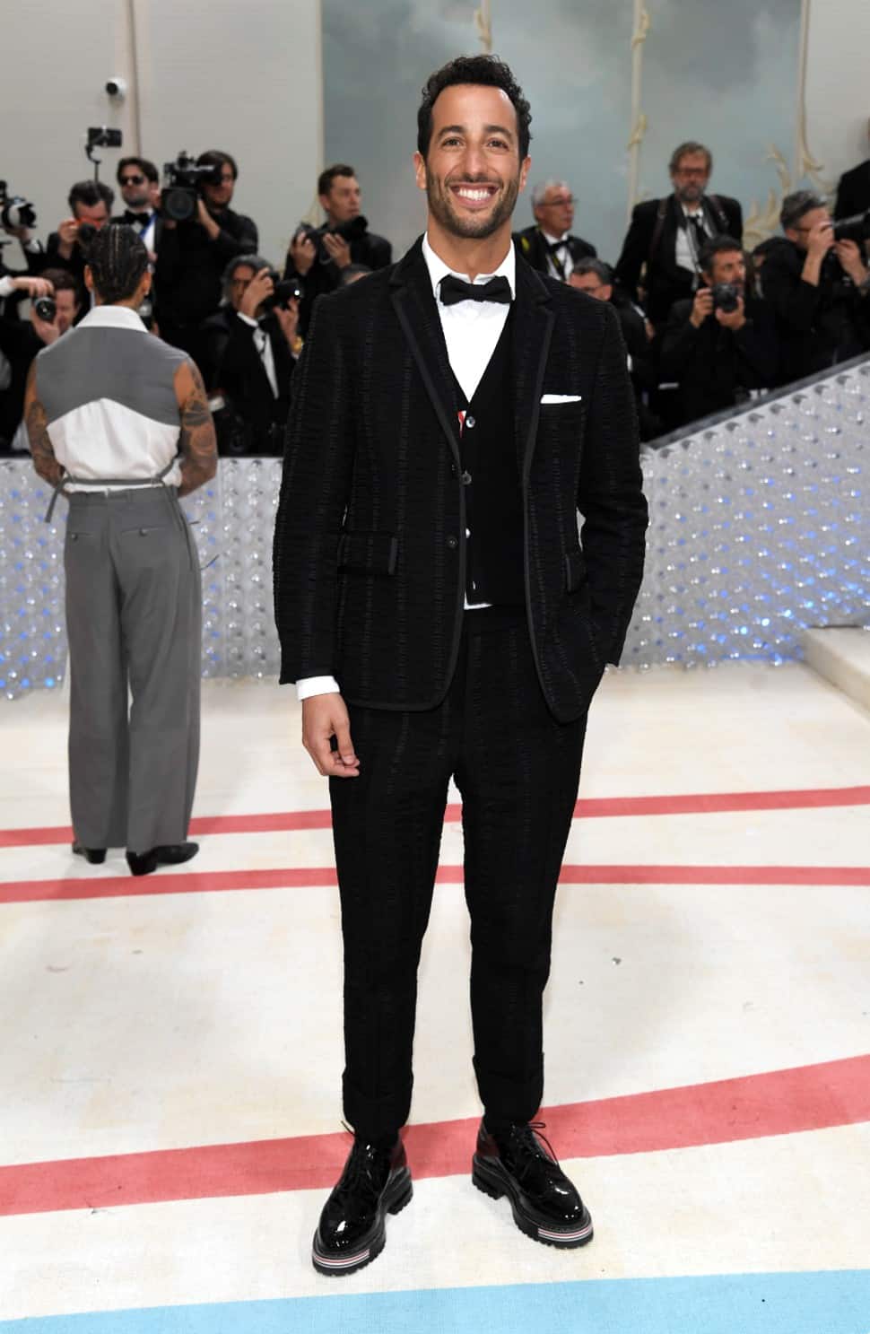 Former Formula One driver Daniel Ricciardo from Australia wore a black textured three piece suit at the Met Gala 2023 in New York. (Photo: AP)