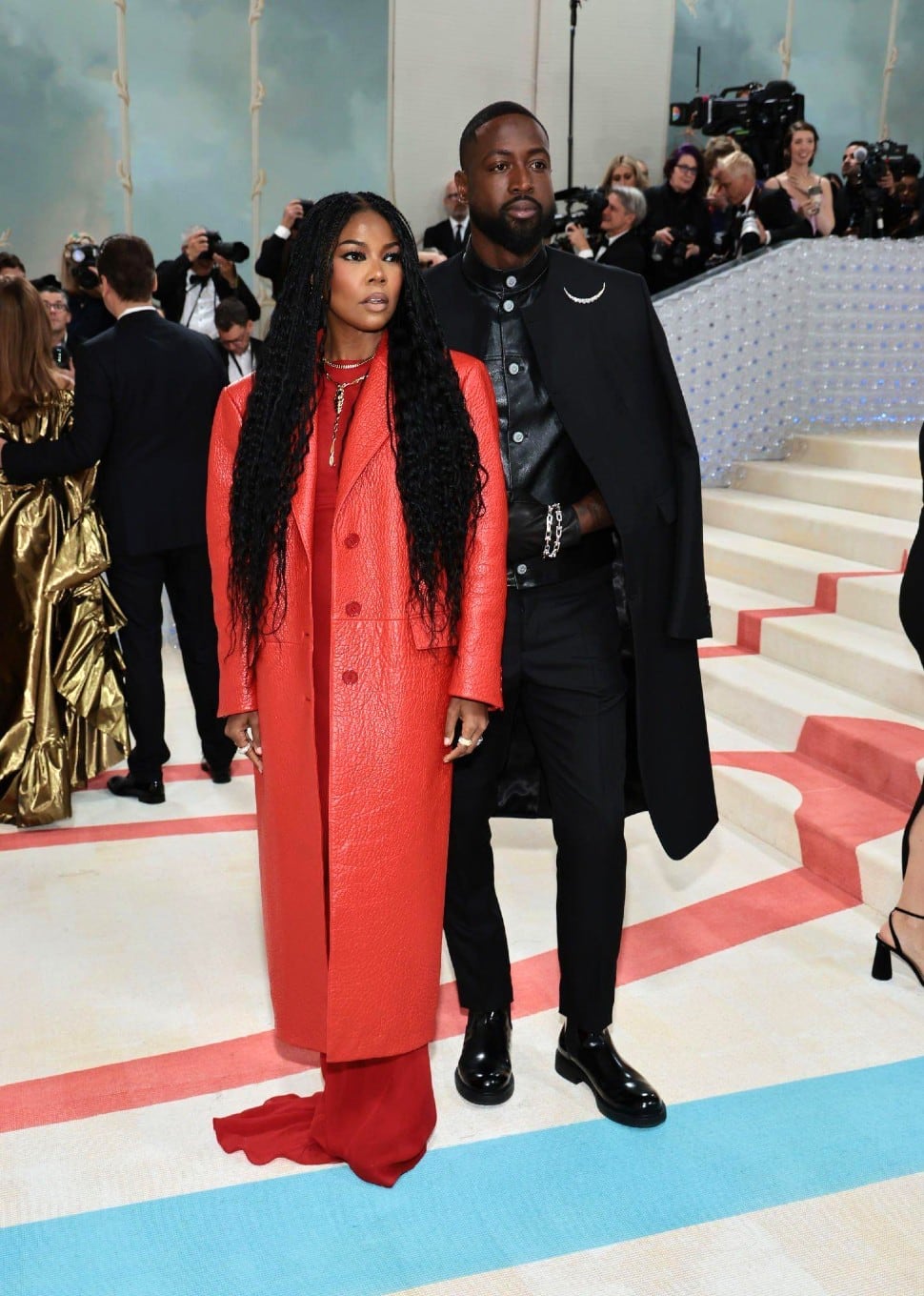 Former NBA star Dwyane Wade went for biker chic in a leather Prada look at the Met Gala 2023. He wore a black vest and paired it with a black overcoat. His wife and Hollywood star Gabrielle Union matched him all the way. (Source: Twitter)