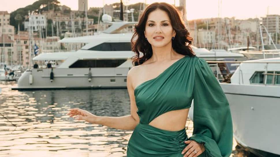 Sunny Leone Oozes Oomph In A Green Thigh-High Slit Satin Dress At Cannes 2023