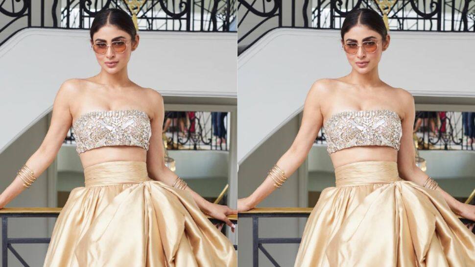 Mouni paired her top with a golden ruffled skirt