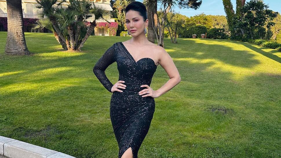 Sunny Leone Looks Breathtaking In Black Cut-Out Shimmering Gown On Amfar Red Carpet at Cannes 2023
