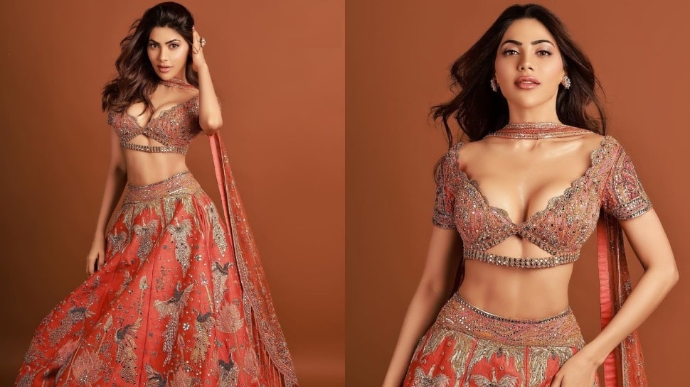 Nikki Tamboli is irresistible, bold and beautiful in deep-neck shimmery  blouse and lehenga, come check out