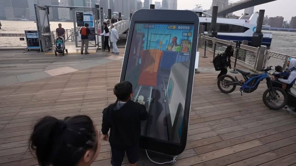 Viral Video: YouTuber Creates World’s Biggest Functional iPhone, Puts 8-Foot Long Phone On Public Display