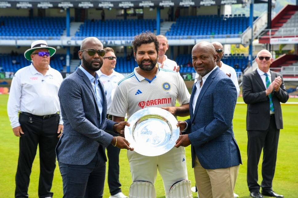 India and West Indies became the only countries after Australia and England to play in 100 Tests. Rohit Sharma receives a plaque from former WI captain Brian Lara on occasion of 100th Test between the two sides in Trinidad on Thursday. (Photo: AP)