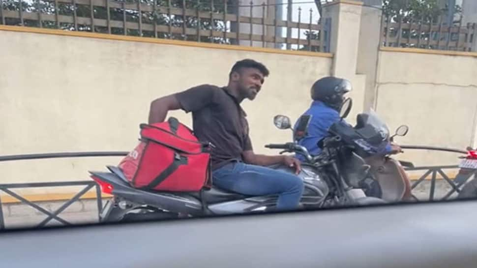 WATCH: Zomato Delivery Guy Seen Eating Customer&#039;s Food At Traffic Signal In Bengaluru