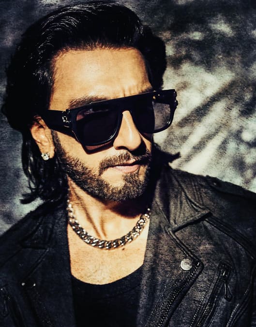 Ranveer Singh wears a black leather jacket and cool sunglasses