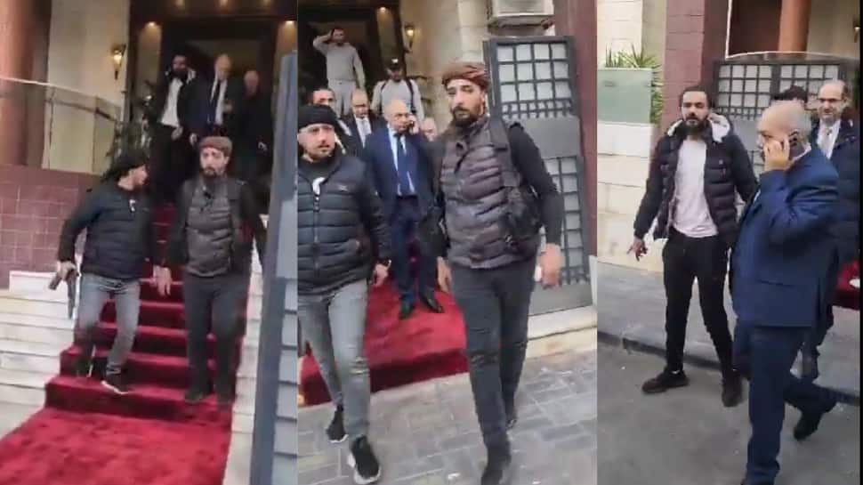 Watch: Rebels Escort Syrian Prime Minister Out Of Workplace As Assad Regime Falls