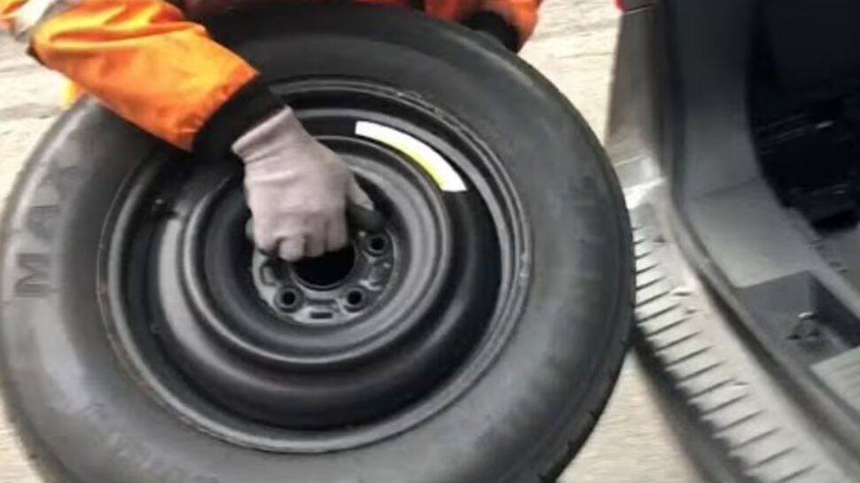 Remove the Flat Tyre and Replace It Remove the Flat Tyre and Replace It