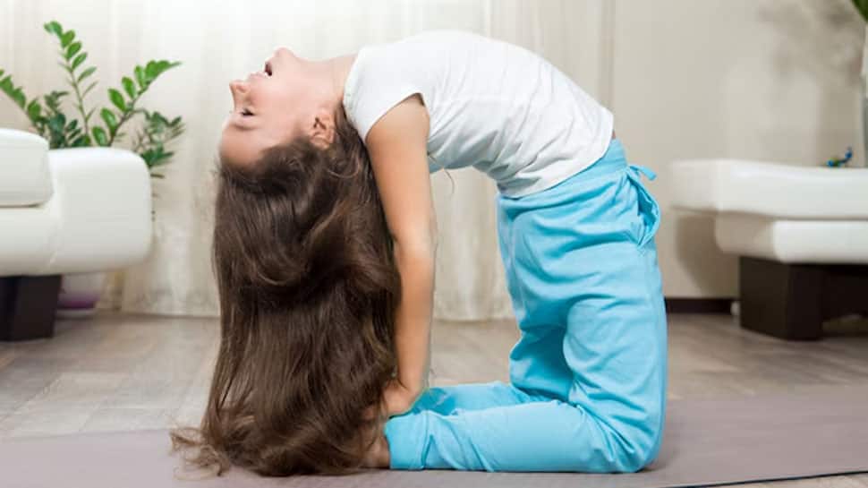 7 Easy Yoga Asanas That Can Help In Hair Growth - In Pics | News | Zee News