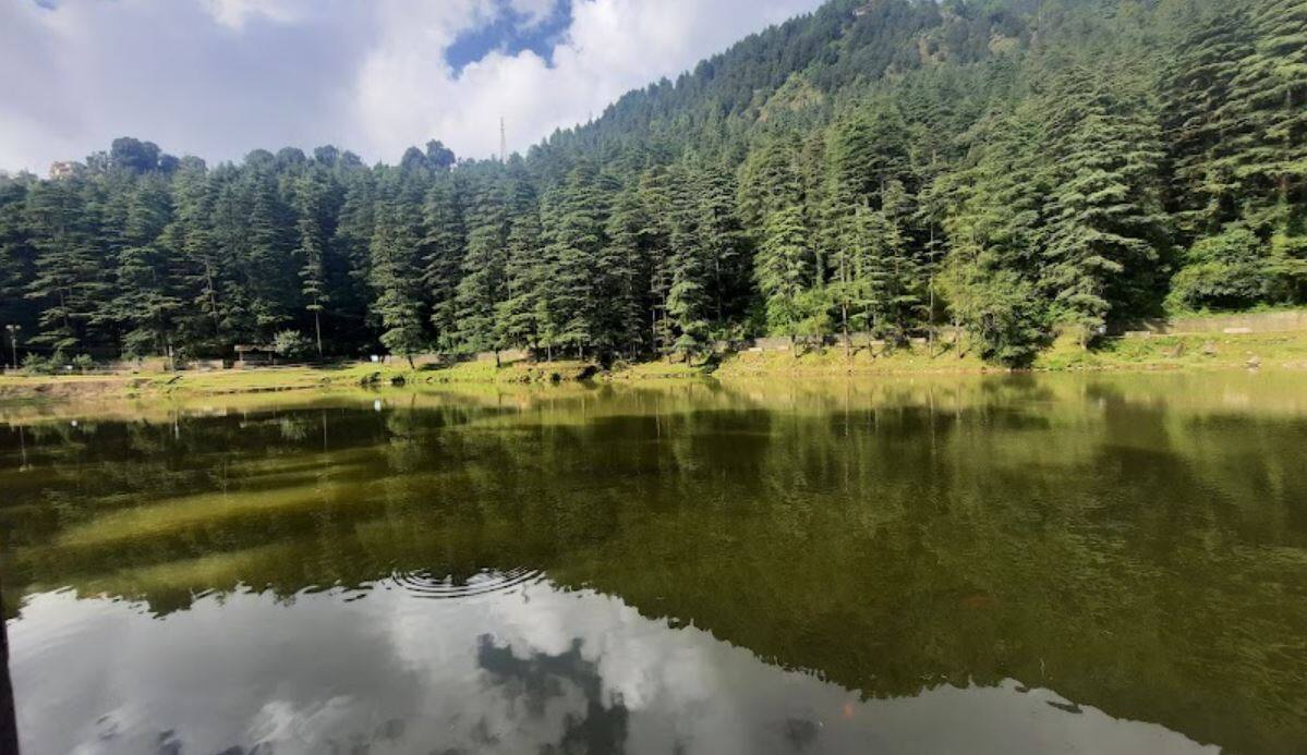Relax by the Tranquil Dal Lake best places to visit in Dharamshala, Dharamshala travel guide, HPCA Stadium Dharamshala, Triund trek