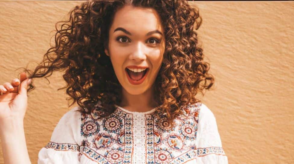 Curly Hair In The Heat: How To Keep Your Curls Defined And Hydrated