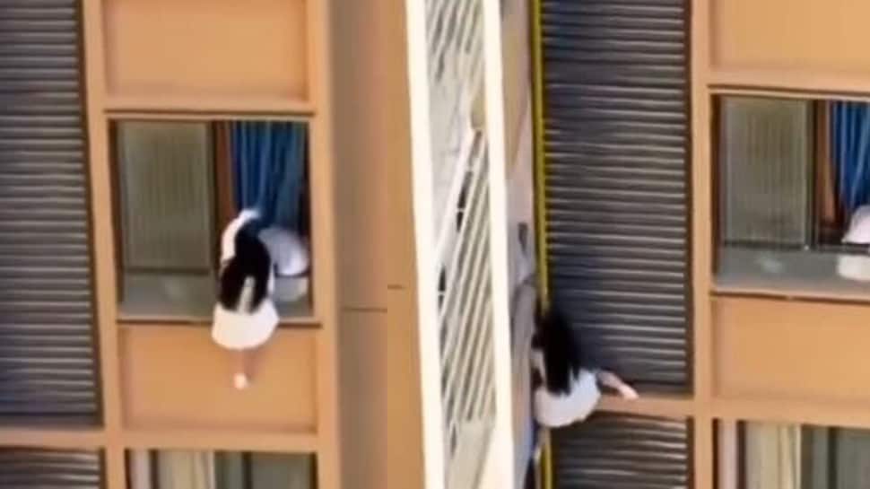 Dangerous Love: Woman Dangles From High-Rise To Escape Lover’s Wife - Watch Shocking Video