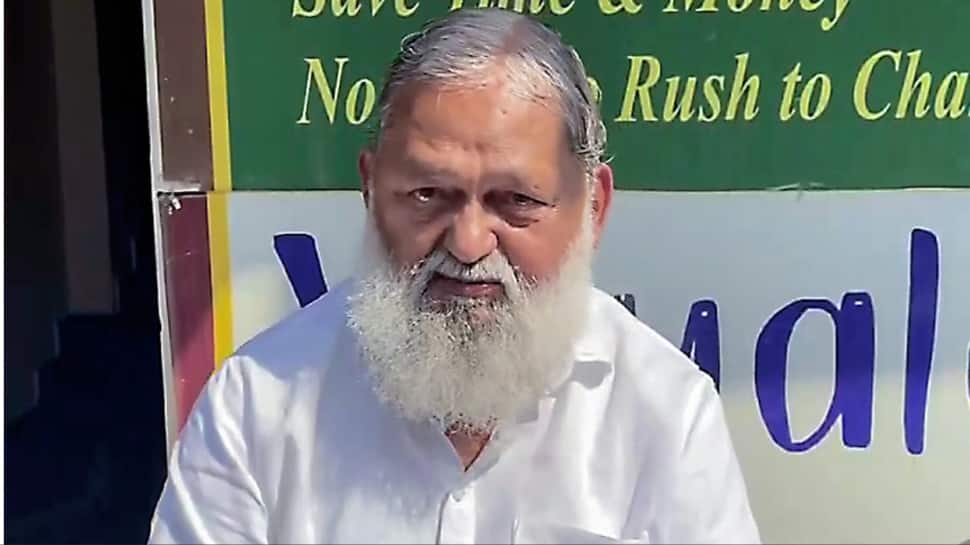 Haryana Health Minister Anil Vij breaks both legs after slipping at home; advised to have one month of bed rest | India News | Zee News