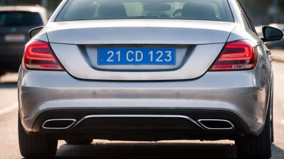 Why some cars have blue colour number plates in India?