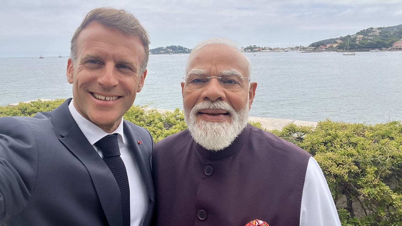 Picture perfect in Nice: Macron`s one-word captioned selfie with PM Modi goes viral