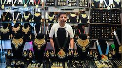 Gold down 30%, silver slides 54% from record highs