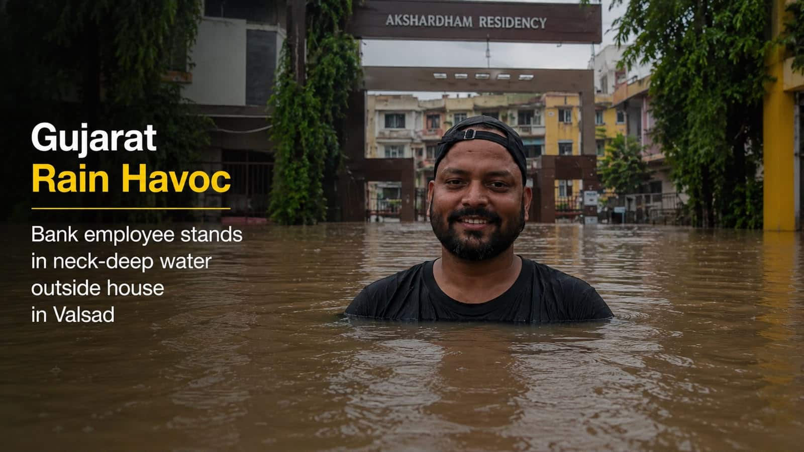 Gujarat rain havoc: Bandhan Bank employee stands in neck-deep water outside house in Valsad; viral video shows flood shock