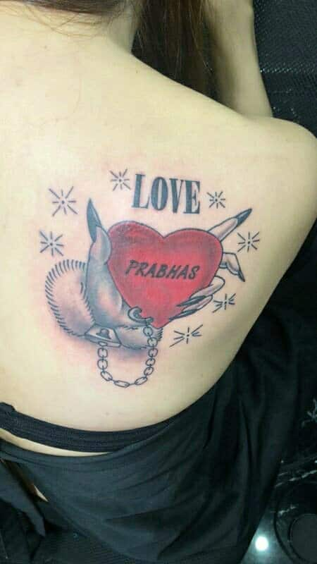 Painful day! Prabhas fan gets tattooed!