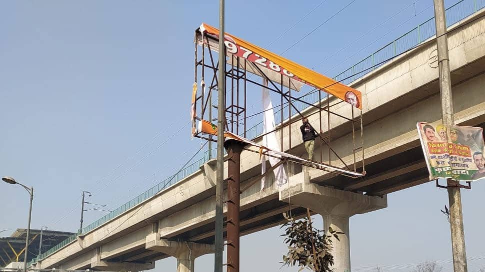 Farmers tear BJP poster as they march towards Delhi