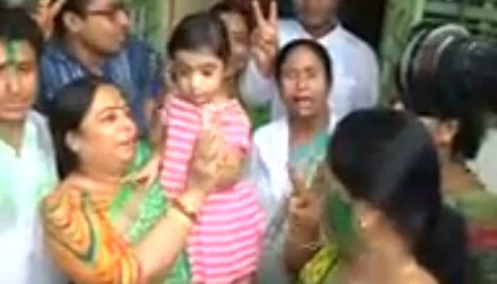 A visibly happy Mamata Banerjee clicked with relatives outside her residence.