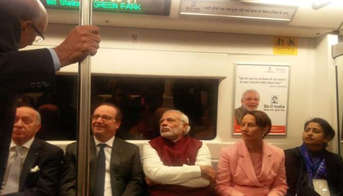 Prime Minister Narendra Modi with French President in Delhi Metro. Photo: Twitter/@PMOIndia