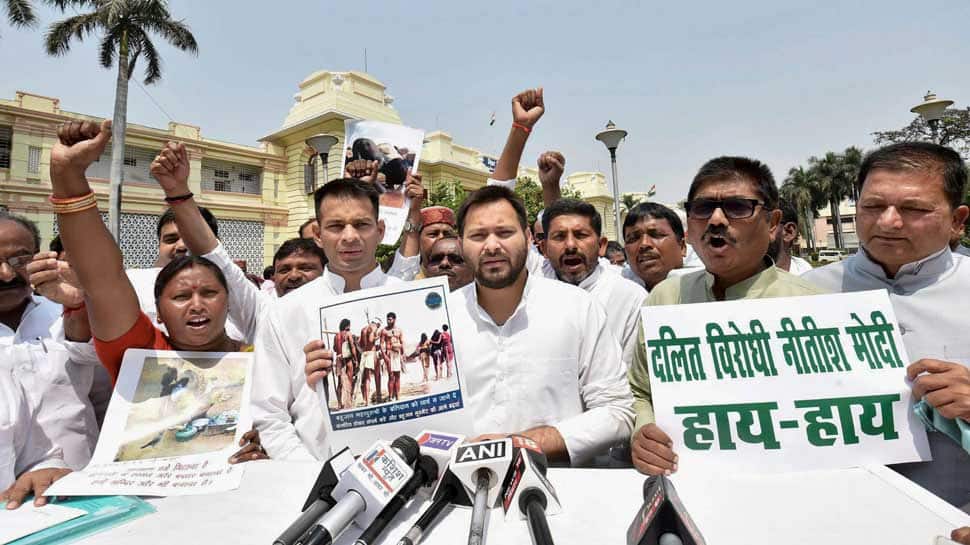 Bharat Bandh: RJD leader of opposition Tejashwi Yadav with MLAs stage a protest against the alleged &#039;dilution&#039; of the SCs/STs Act by Supreme court, at Bihar Assembly in Patna on Monday (PTI photo)