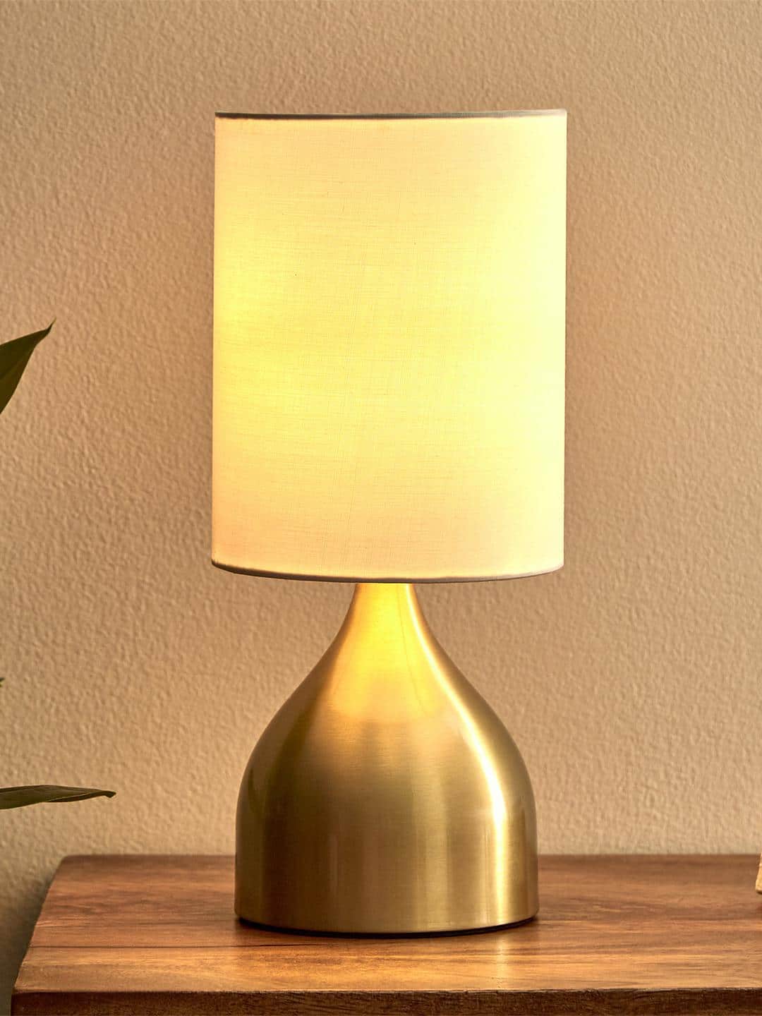 Home Centre Albama Okien Gold-Toned Textured Cylindrical Shaped Table Lamp Home Centre Albama Okien Gold-Toned Textured Cylindrical Shaped Table Lamp