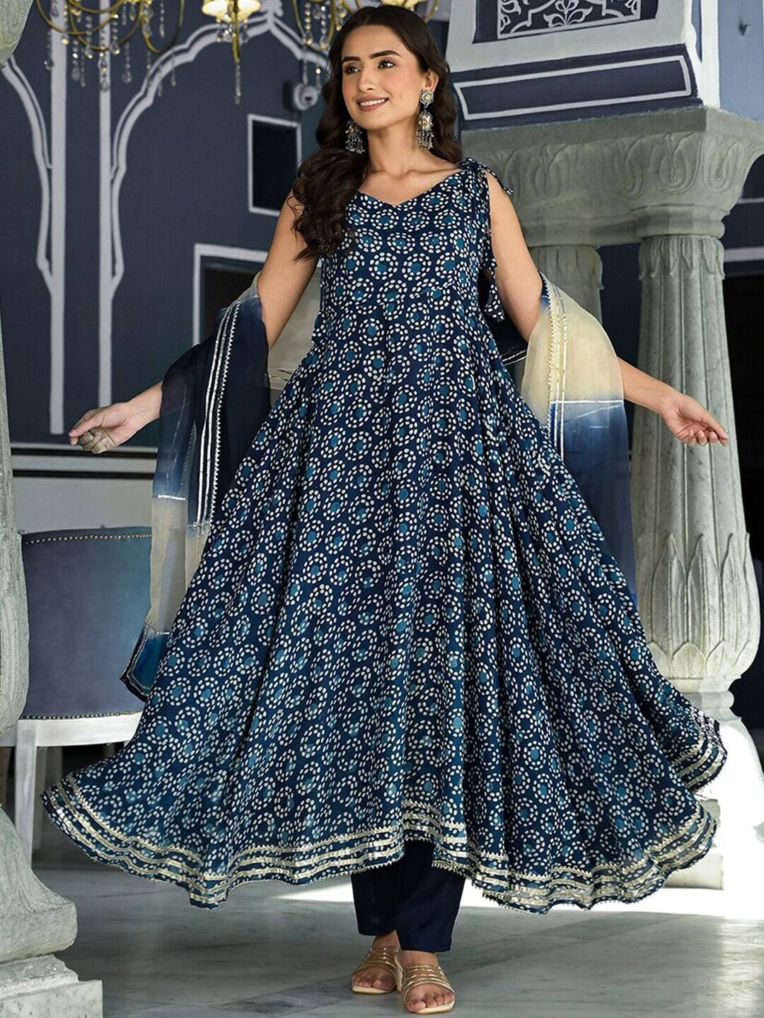 https://www.myntra.com/kurta-sets/divena/divena-printed-sleeveless-indigo-anarkali-kurta-with-trousers--dupatta/25667342/buy