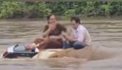 Watch: Couple Spends Two Hours On Submerged Car In Gujarat Floods