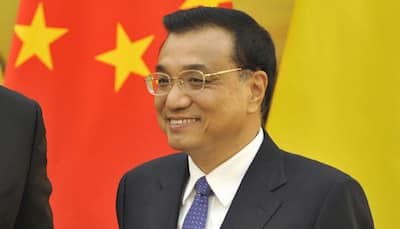 China`s Li Keqiang blinded by the light at Youth Olympics 