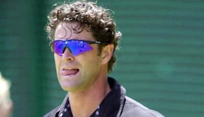 Former New Zealand cricketer Chris Cairns cleaning bus shelters to make ends meet