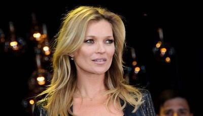 Kate Moss poses in lingerie for a cause