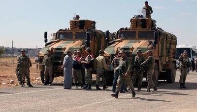 Iraqi Kurds approve sending fighters to aid Syrian town Kobane